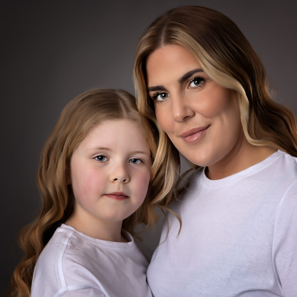 Mama and Me Photography in Halton Cheshire both mummy and daughter are wearing plain white t-shirts and have long blonde hair